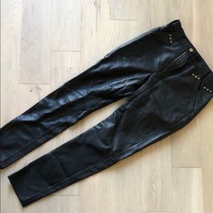 Never worn black leather pants with gold studs